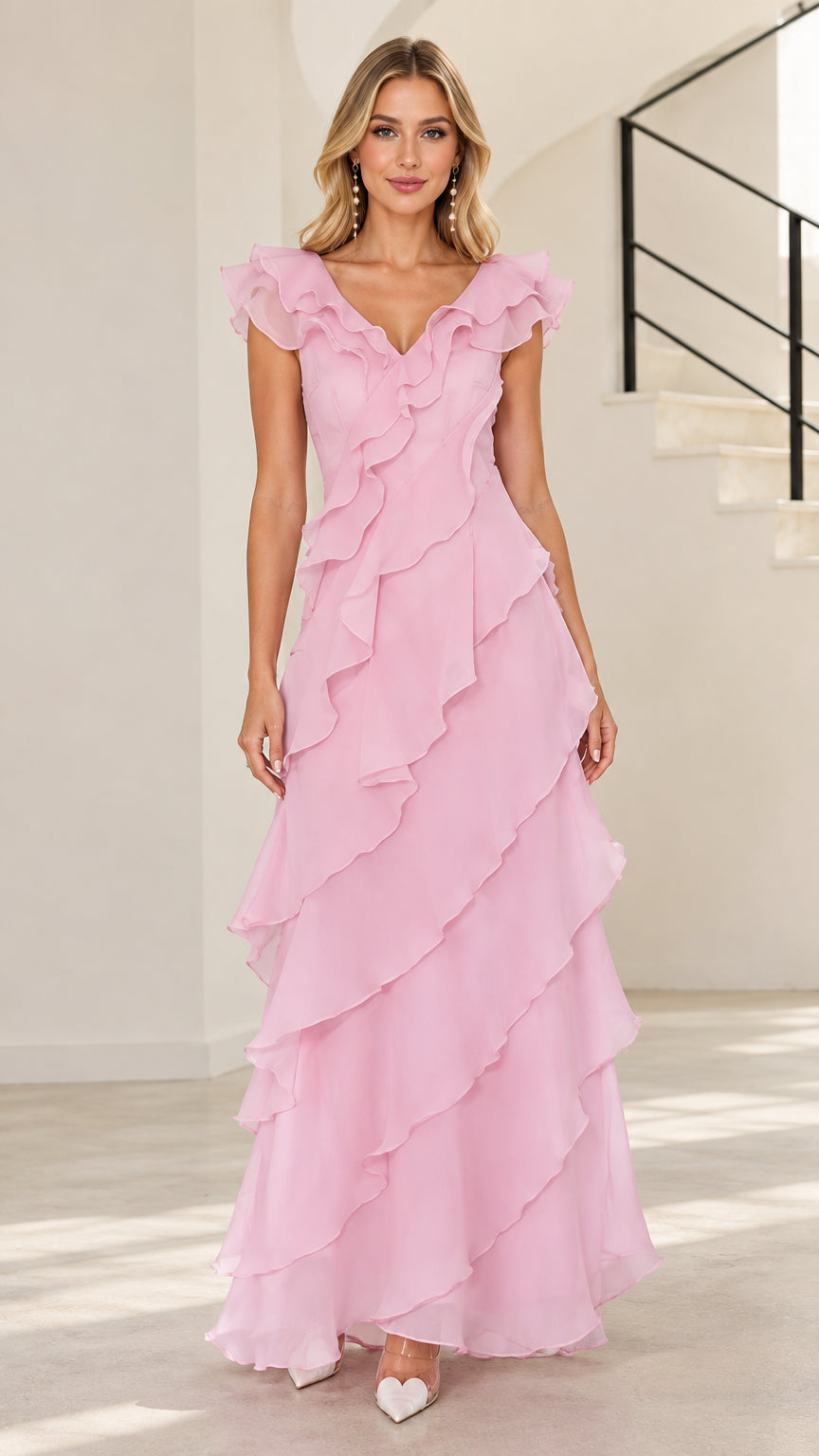 Front full-length view of woman in blush pink tiered ruffle V-neck maxi evening gown