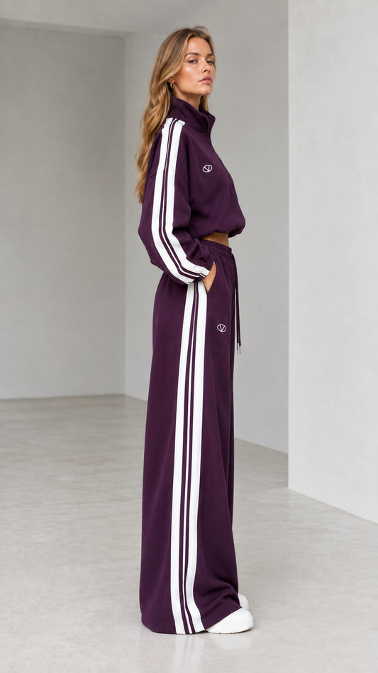 Side profile of woman in deep plum two-piece wide-leg sweatsuit set