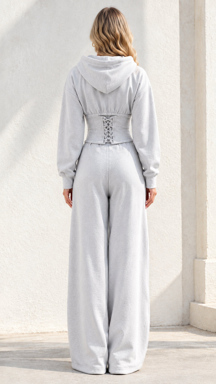 Back view of Light Grey corset hoodie showing lace-up back waist detail