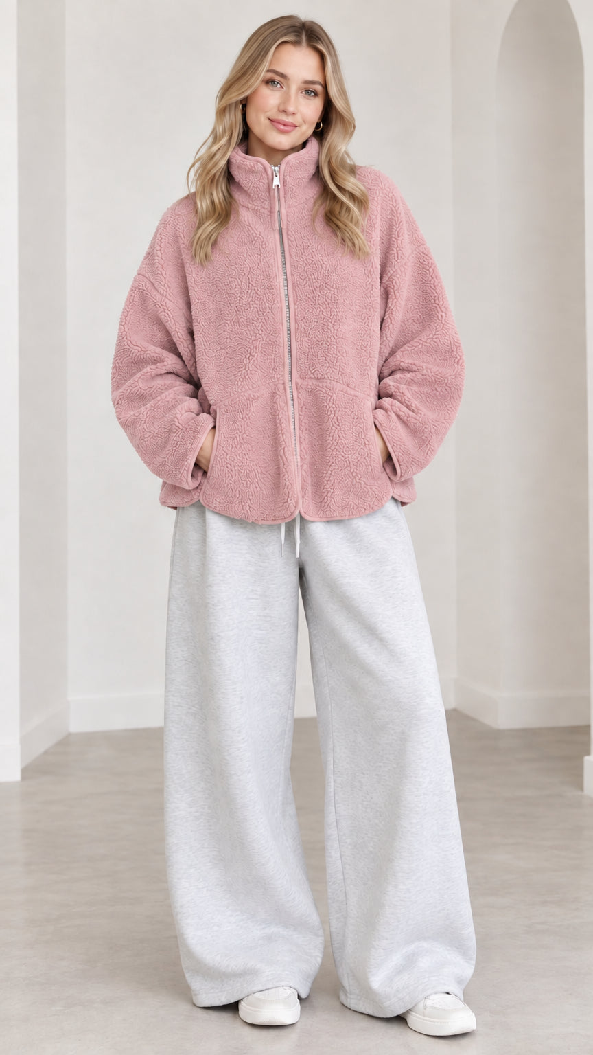 Model wearing dusty pink fleece zip jacket