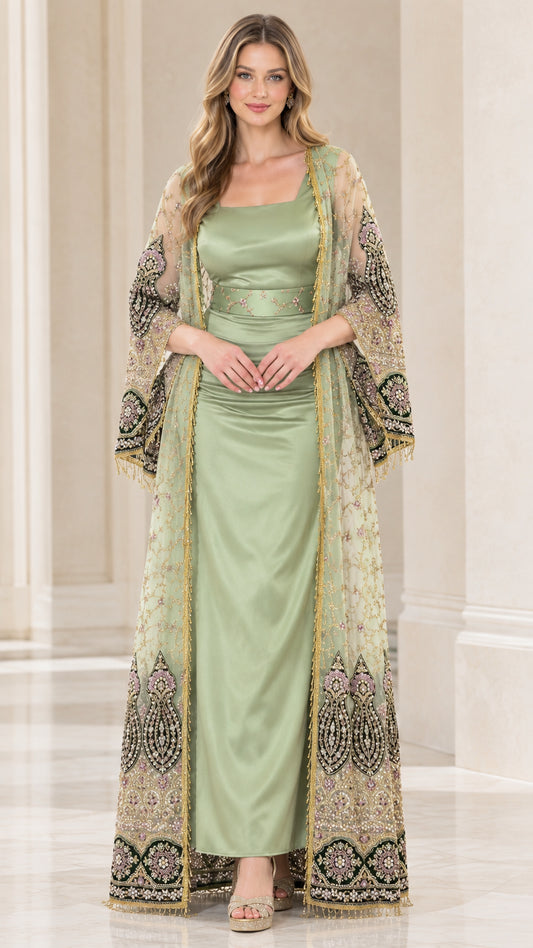 Front view of woman wearing sage green embroidered duster coat over matching satin maxi dress
