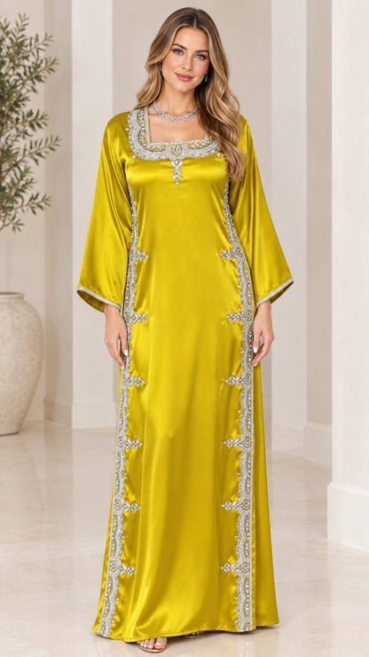 Front view of model wearing chartreuse satin embellished maxi kaftan dress