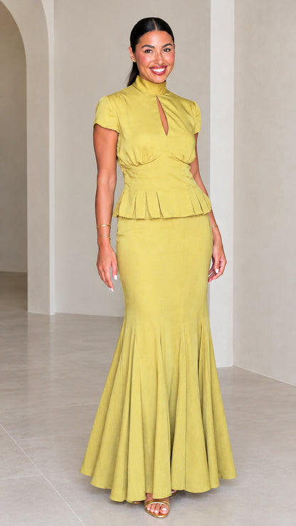 Front full-length view of woman wearing Chartreuse high neck peplum mermaid maxi dress set