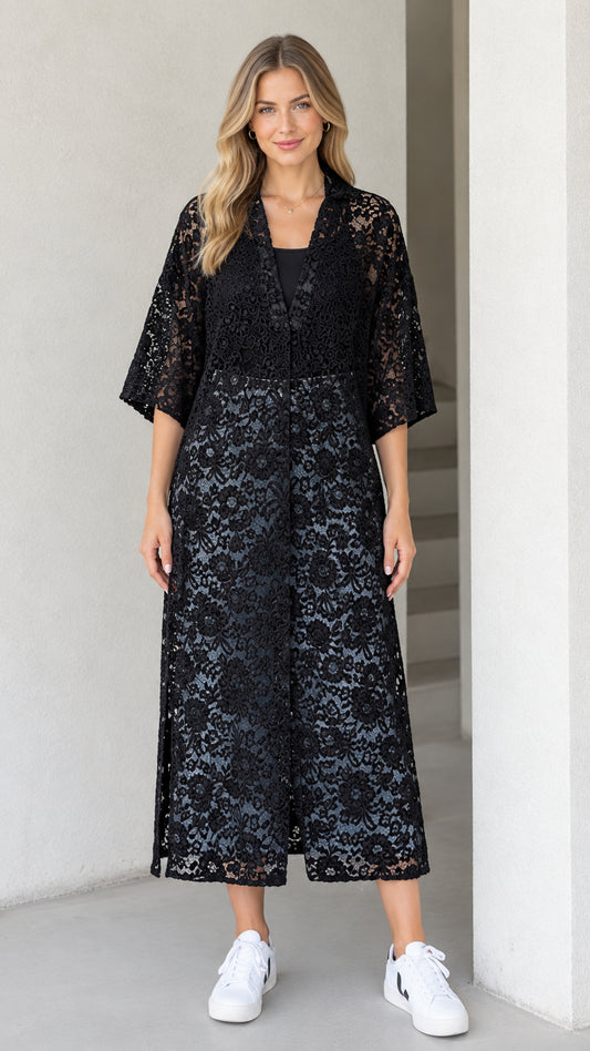 Front view of model wearing black floral lace midi duster dress with 3/4 sleeves