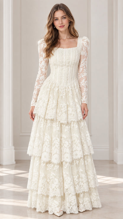 Front view of model wearing ivory long sleeve tiered lace maxi dress