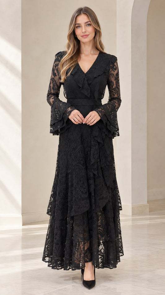 Front full view of woman wearing black tiered floral lace maxi dress with bell sleeves