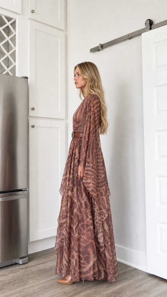 Side profile view of woman modeling the brown draped sleeve flowy maxi dress
