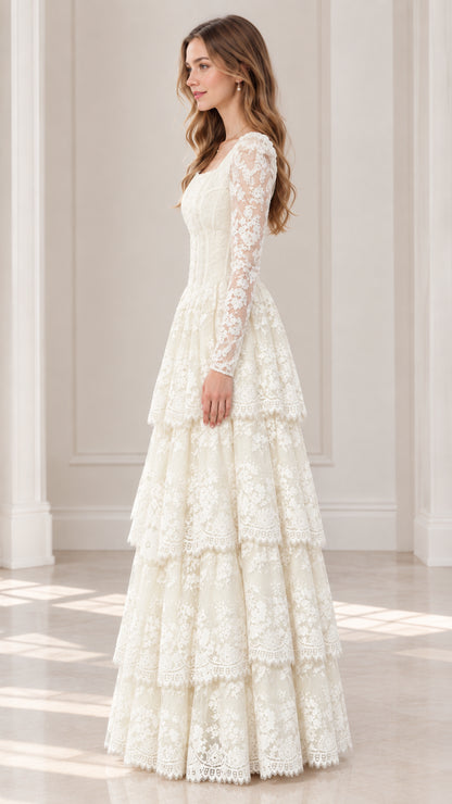 Side profile view of model wearing ivory long sleeve tiered lace maxi dress