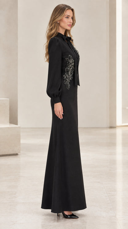Side angle view of black bow neck evening gown