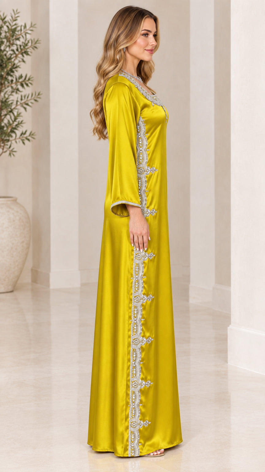 Side profile view of chartreuse satin maxi kaftan dress showing side embroidery
