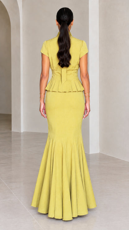 Back view of Chartreuse peplum maxi dress showing tie back neckline and mermaid flare