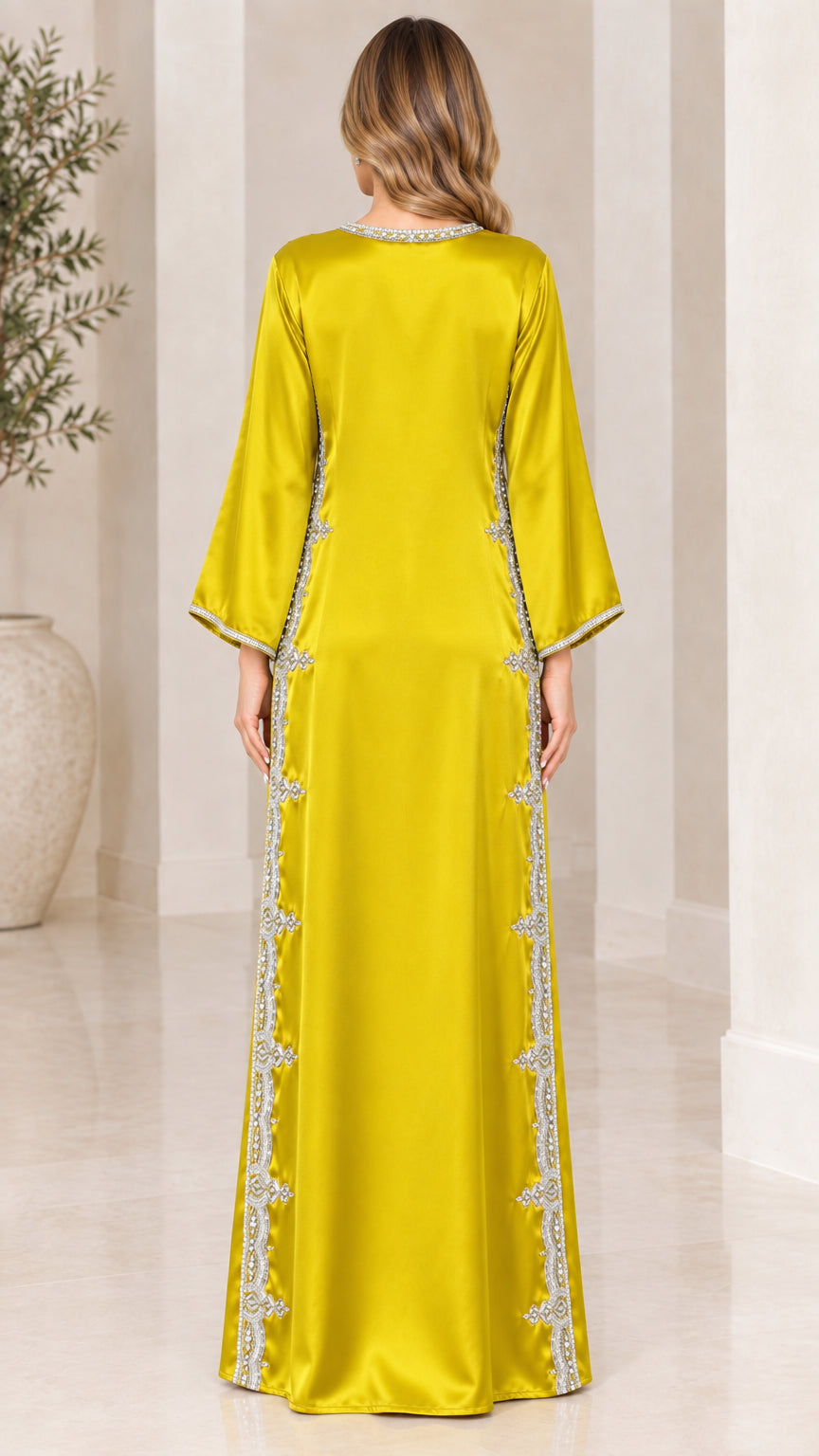 Back view of model wearing chartreuse satin flare sleeve maxi kaftan dress