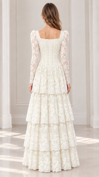 Back view of model wearing ivory long sleeve tiered lace maxi dress