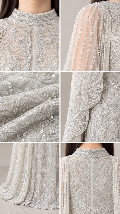 Close-up details of collar beadwork, sheer cape sleeve, sequin texture, and back zip