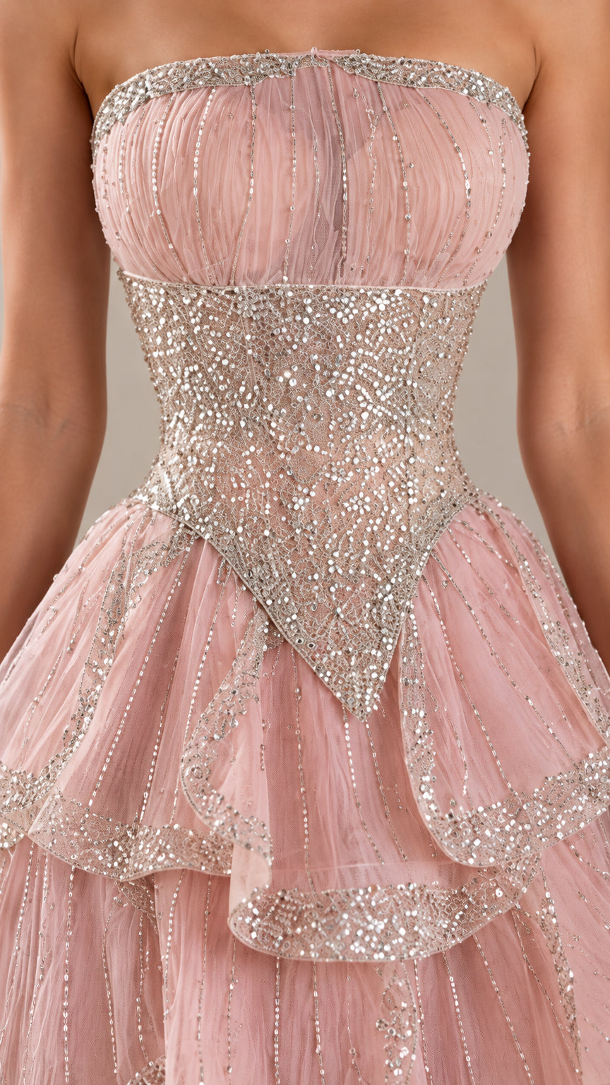 Close-up of sparkling sequin embellished bodice and tiered skirt details