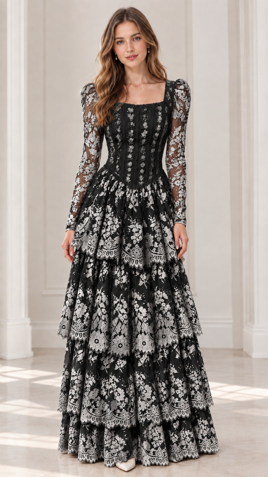 Front view of model wearing black long sleeve tiered lace maxi dress