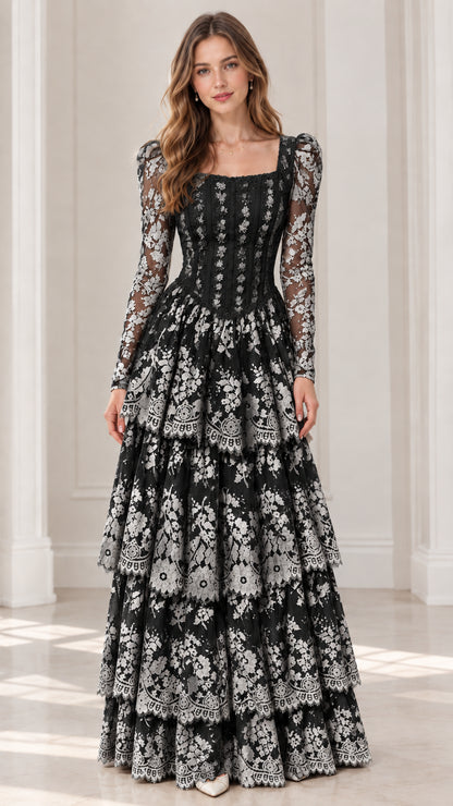 Front view of model wearing black long sleeve tiered lace maxi dress