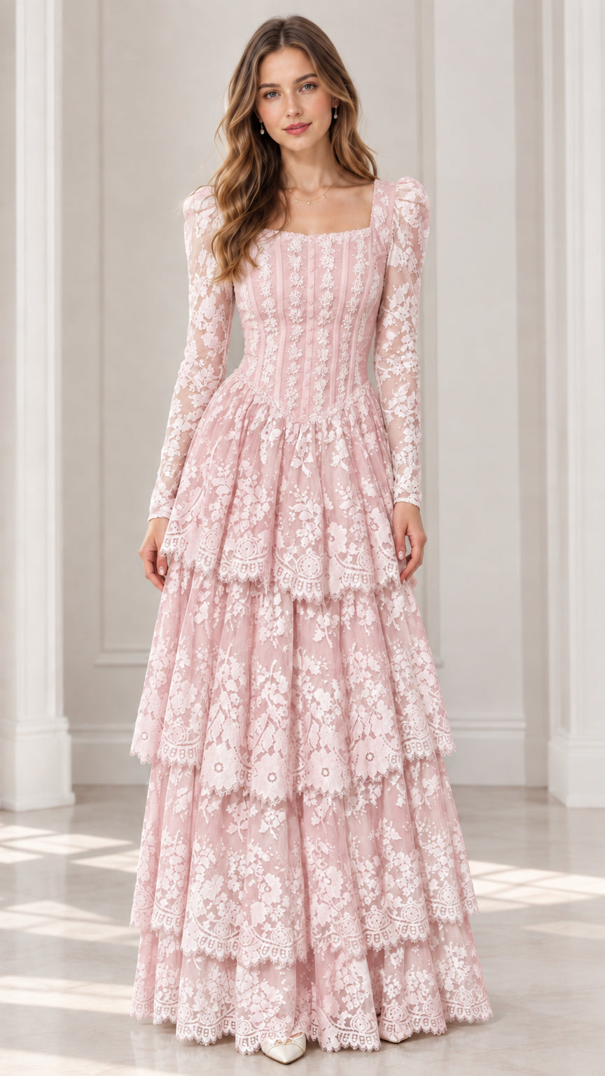 Front view of model wearing blush pink long sleeve tiered lace maxi dress