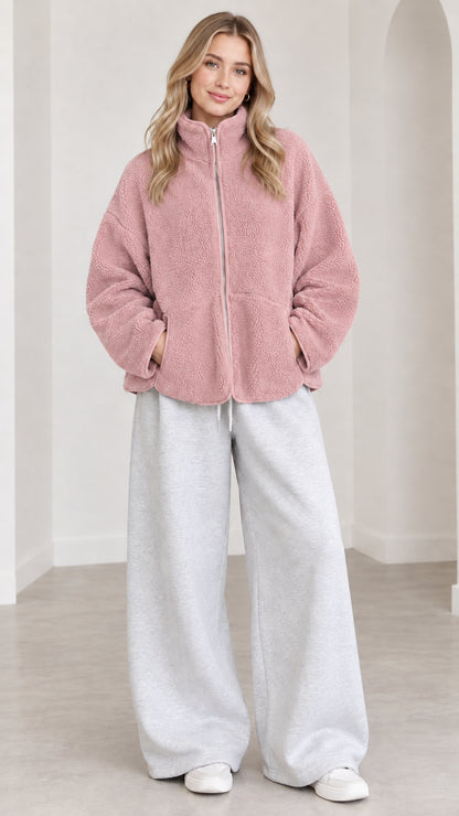 Model wearing dusty pink fleece zip jacket