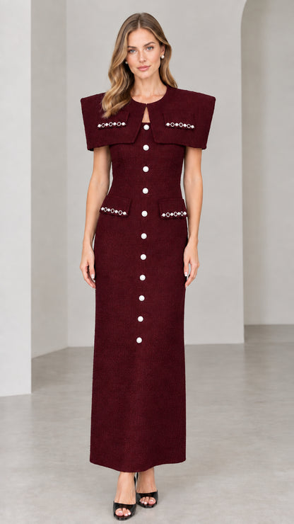 Front view of burgundy red capelet tweed maxi dress with pearl trim